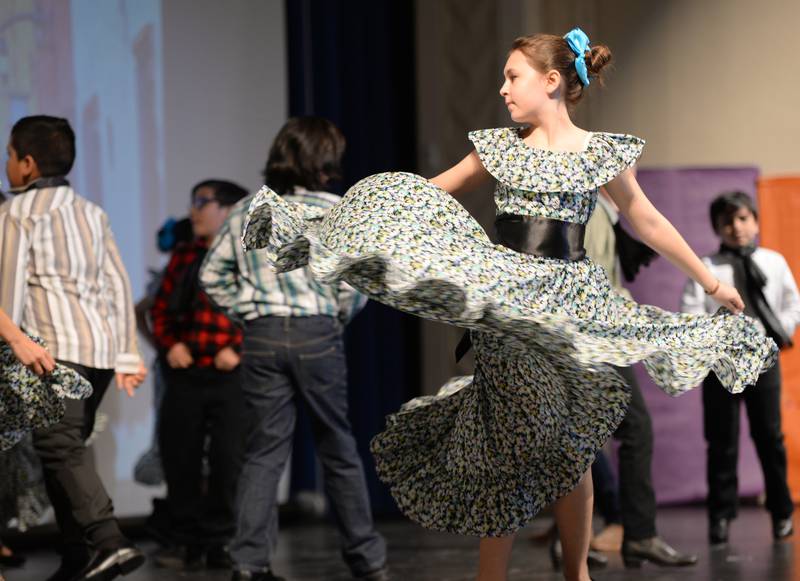 Congress Park  5th grader June Brian dances to celebrate Baja California Sur, Mexico while participating in the  Expo De Bellas Artes held at Park Junior High Friday April 21, 2023.