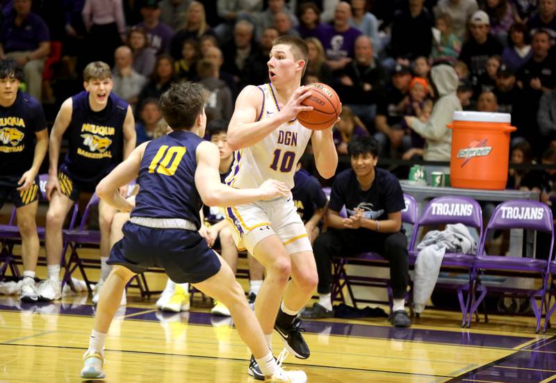 Downers Grove North’s Bobby Grganto looks to pass the ball around Neuqua Valley’s Luke Pallaschke during the Class 4A Downers Grove North Regional final on Friday, Feb. 23, 2024.