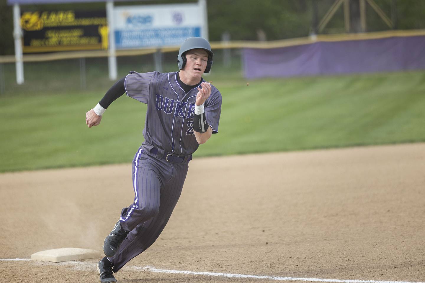 Dixon’s Aiden Wiseman rounds third base against Rock Falls to score Monday, April 22, 2024 in Dixon.