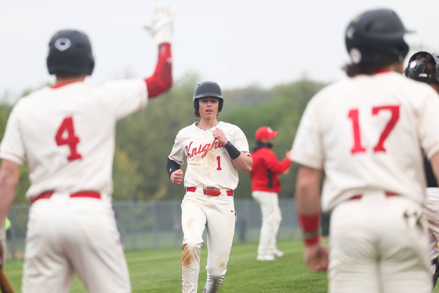 Lincoln-Way Central’s Landon Mensik scores on a Jack Novak double against Lincoln-Way West on Monday, May 8, 2023 in New Lenox.