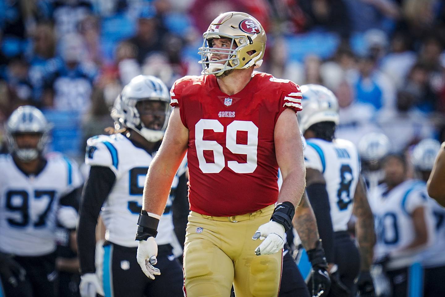 San Francisco 49ers offensive tackle Mike McGlinchey looks at the video board during a game against the Carolina Panthers on Sunday, Oct. 09, 2022, in Charlotte, N.C.