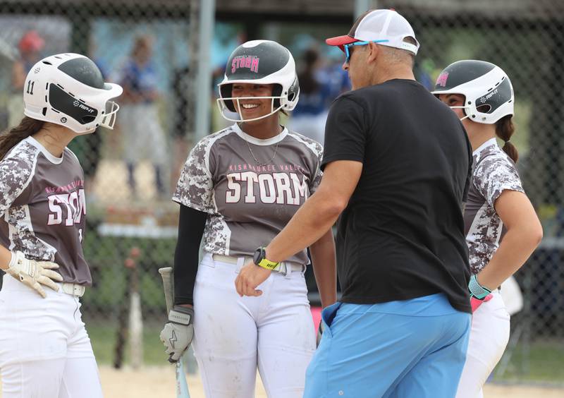 Kishwaukee Valley Storm players talk to their coach during a time out Friday, June 27, 2025, during their 16u game against Northern Ice in the Storm Days tournament at the Sycamore Community Sports Complex.