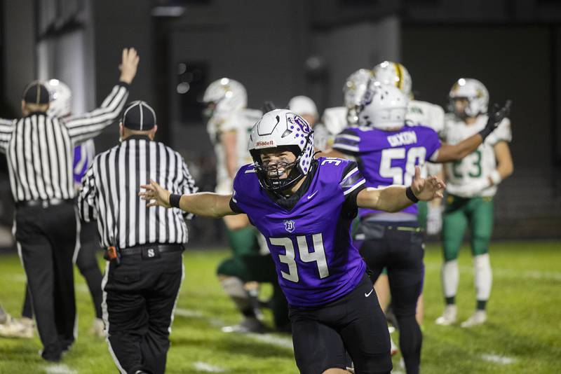 Dixon’s Owen Belzer celebrates a recovered fumble for the Dukes against Coal City in round 2 of the Class 4A football playoffs Friday, Nov. 7, 2025.