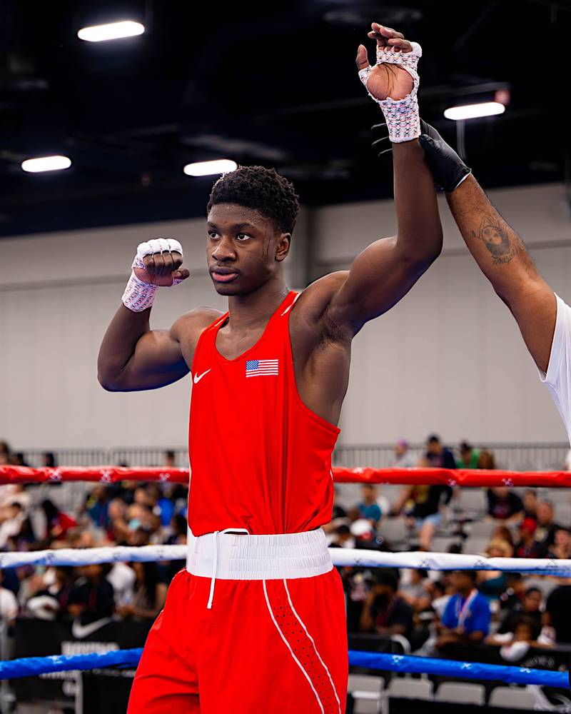 Joliet JoJo Awinongya has his hand raised after winning his 25th national title at the USA Boxing National Junior Olympics and Summer Festival in Las Vegas.