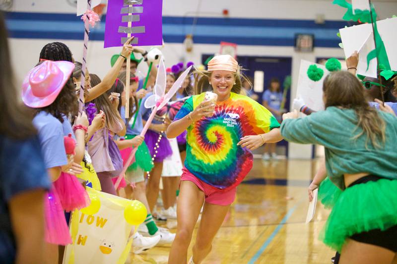 Downers Grove South freshmen enter the gym at the Mustang Mad Dash orientation on Saturday Aug.10, 2024 in Downers Grove.