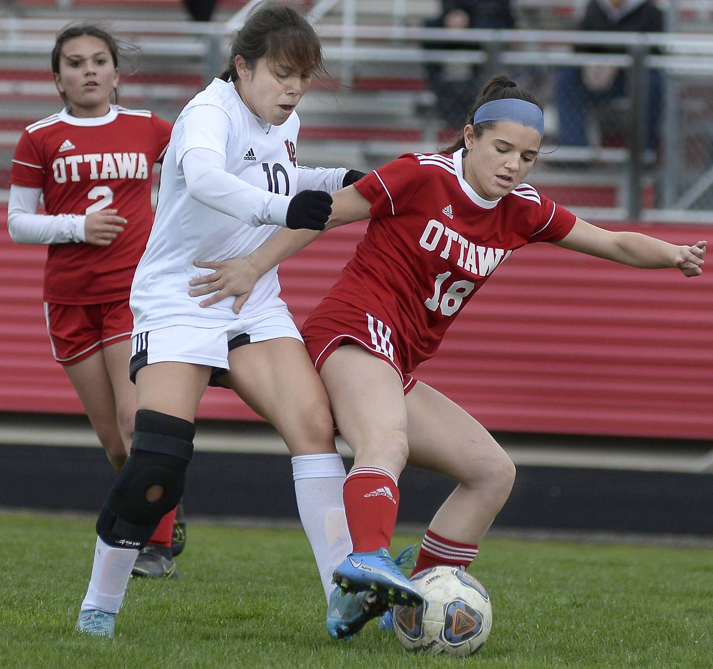 La Salle Peru’s Litzy Lopez and Ottawa’s Gabi Krueger work for control of the ball during first half of Wednesday's Interstate Eight Conference match at King Field in Ottawa. 04/06/22. Tom Sistak Photo
