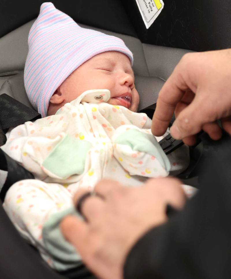 Eleanor Lee Altepeter-Knotts, from Kingston naps Thursday, Nov. 2, 2023, as she and her parents visit the Genoa-Kingston Fire Department in Genoa. The family stopped by to thank the ambulance crew that delivered the baby Sept. 29 when they realized they weren’t going to make it to the hospital in time.