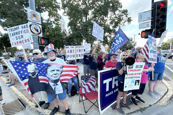 Anti- and pro-Trump signs displayed during ‘Workers Over Billionaires’ rally in downtown Oregon