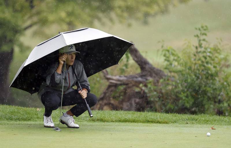 Jack Van Laningham, St. Charles North, looks for his line to the cup during the DuKane Conference Boys Varsity Tournament Tuesday, Sept. 24, 2024 Bartlett Hills Golf Club.
