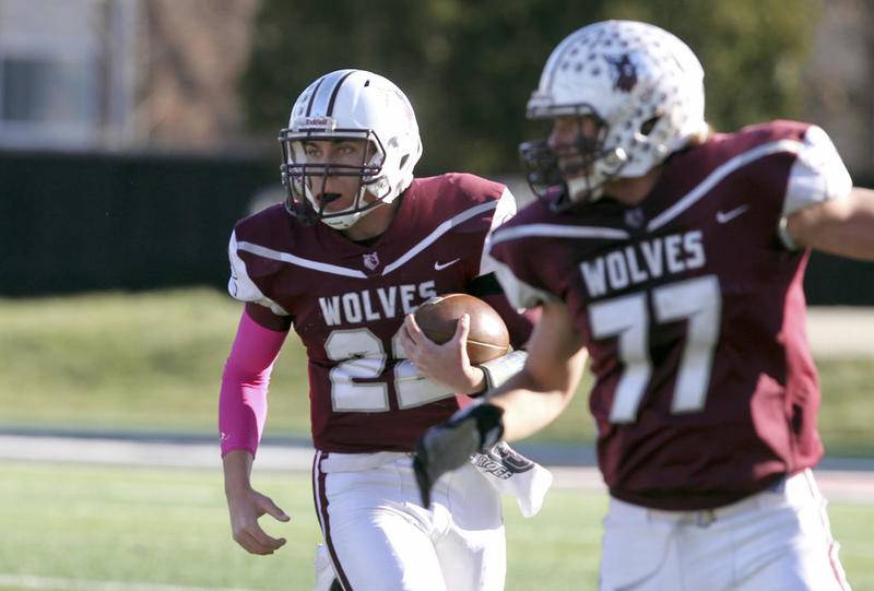 Prairie Ridge's Samson Evans runs behind the blocking of Jeff Jenkins during the Class 6A state championship Saturday Nov. 25, 2017 at Northern Illinois University's Huskie Stadium.