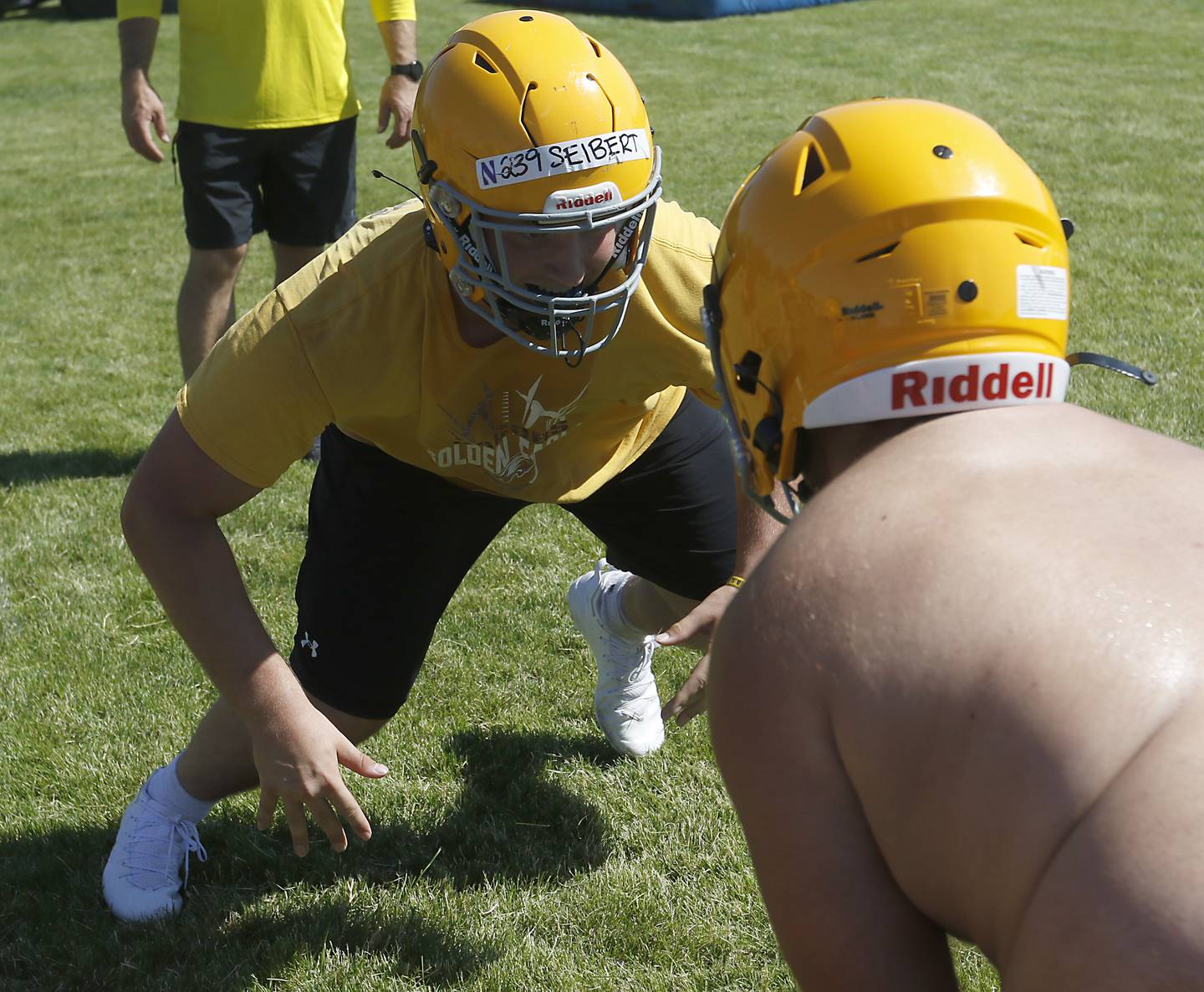 Will Siebert rushes a blocker during football practice Monday, June 20, 2022, at Jacobs High School in Algonquin.