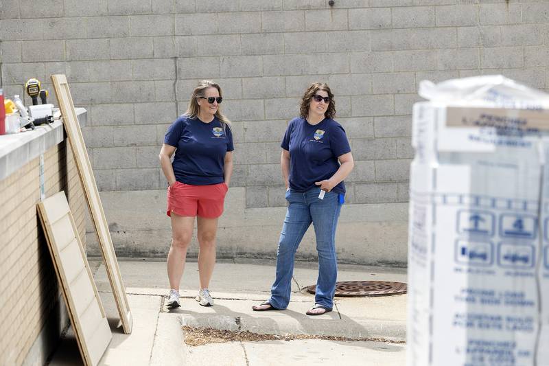 Joyce Lewis (left), grant coordinator at the Ogle County Health Department, and Cherie Rucker, director of Public Health Programs at Ogle County, watch as construction of the newest mini-food center takes place May 16, 2025, in Dixon.