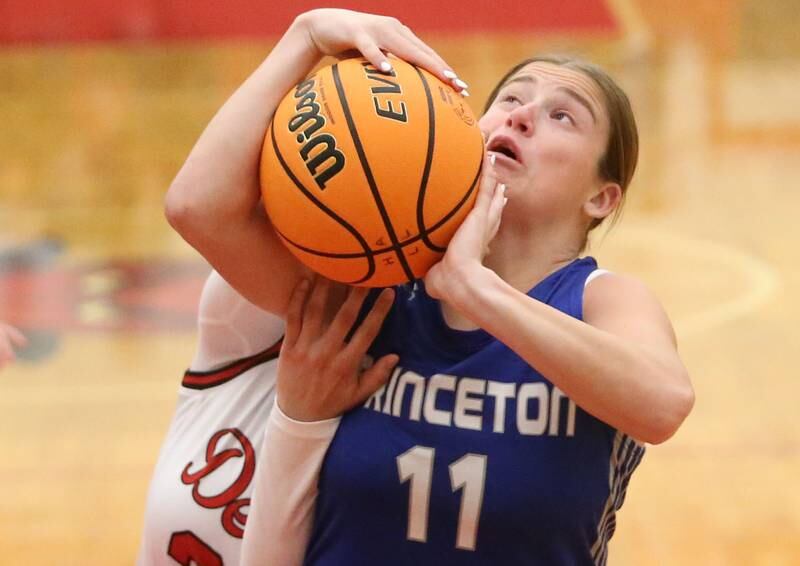 Princeton's Makayla Hecht hangs on to the ball as Hall's Natalia Zamora defends on Monday, Jan. 6, 2025 at Hall High School.