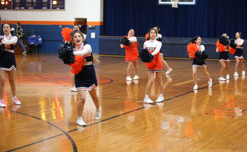 DePue cheerleaders perform at halftime during the game against Midland on Monday, Dec. 19, 2022 at DePue High School.