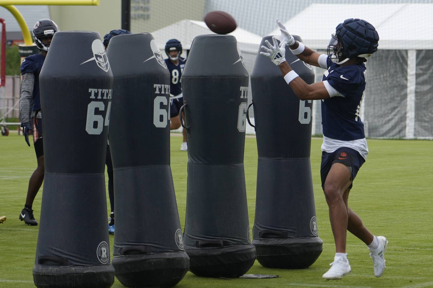 Chicago Bears wide receiver Rome Odunze (15) practices during Back Together training camp event for fans on Saturday, July 26, 2025, in Lake Forest, Ill. Chicago. (AP Photo/David Banks)