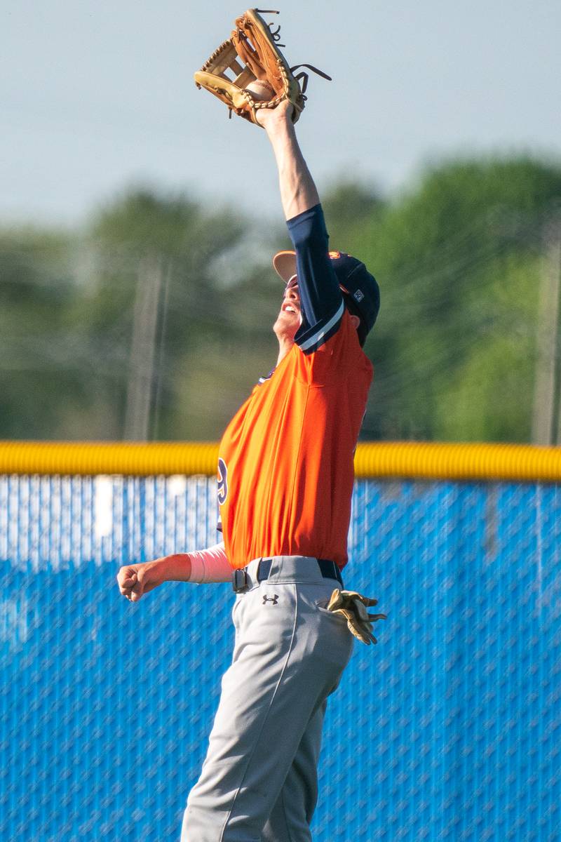 Oswego’s Luke Voelker (19) catches a fly-ball for an out against Oswego East during a baseball game at Oswego East High School on Wednesday, May 10, 2023.