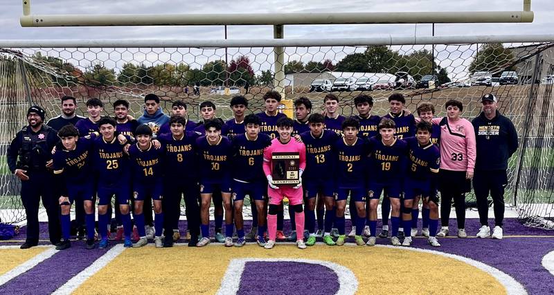 The Mendota boys soccer team poses with its plaque after beating Schaumburg Christian 4-0 to win the Class 1A Mendota Regional championship on Saturday, Oct. 25, 2025.