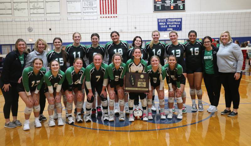 Members of the Rock Falls volleyball team pose with the Class 2A Sectional plaque after defeating Illinois Valley Central in the Class 2A Sectional final game on Wednesday, Nov. 1, 2023 at Princeton High School.