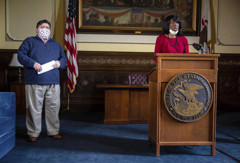 Dr. Ngozi Ezike, director of the Illinois Department of Public Health, delivers the latest numbers for the COVID-19 pandemic during Illinois Governor JB Pritzker's daily press briefing on COVID-19 in his office at the Illinois State Capitol, Thursday, May 21, 2020, in Springfield, Ill. (Justin L. Fowler/The State Journal-Register via AP, Pool)