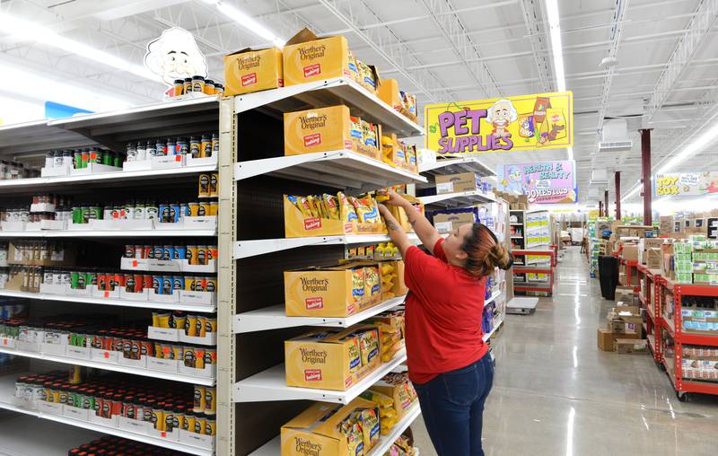 Sales Associate Samantha Rex adjusts boxes of food on one of the shelves at the new Ollie's store in Rock Falls on Monday, Oct. 16, 2023. The store, located at 1002 1st Ave., is slated to open to the public on Wednesday, Oct. 18. Store hours will be 9 a.m. to 9 p.m. Monday through Saturday and 10 a.m to 7 p.m on Sunday.