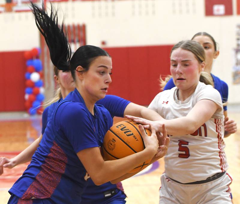Genoa-Kingston's Zoe Boylen and Oregon's Shaylee Davis fight for the ball on Friday, Jan. 30, 2026 at the Blackhawk Center.