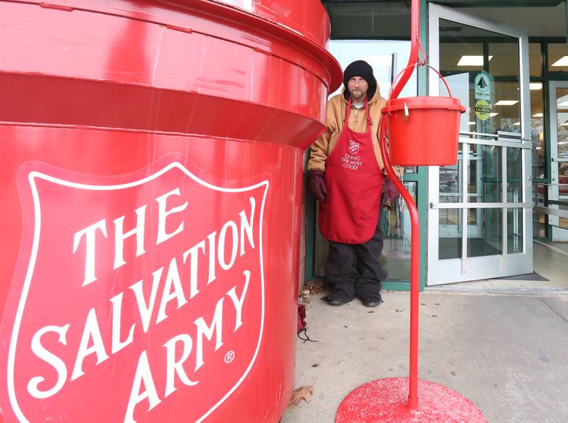 Jacob Robinson a bell ringer with The Salvation Army, stands in front of Handy Foods on Thursday, Dec. 12, 2024 in Ottawa. Robinson has been volunteering with the Salvation Army for six years.