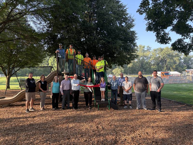 City officials, Streator Area Chamber of Commerce members and Public Works employees gather for a ribbon-cutting ceremony celebrating the installation of a new playground at Merriner Park on Wednesday, Aug. 6, 2025.