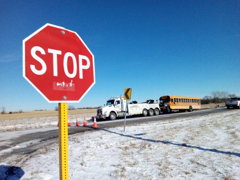 A Manhattan School District 114 bus is towed away from the scene of a crash that occurred on the morning of Thursday, Jan. 15, 2026. The bus was carrying 10 students when it collided with a passenger vehicle near the intersection of Manhattan Monee Road and Kankakee Road in southeastern Will County.