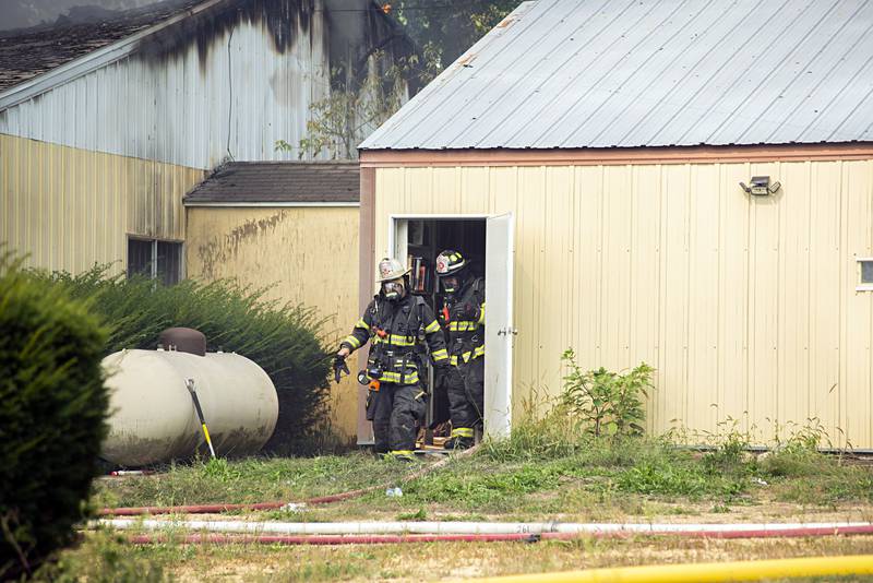 Firefighters work at the scene of a fire at 300 block of Cropsey avenue in Dixon on Monday, Sept. 26, 2022.