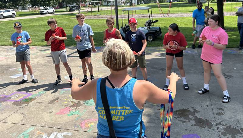 Shauna Zettle gets ready to start one of the watermelon-eating contests at Sauerkraut Days in Forreston on Saturday, Aug. 2, 2025.