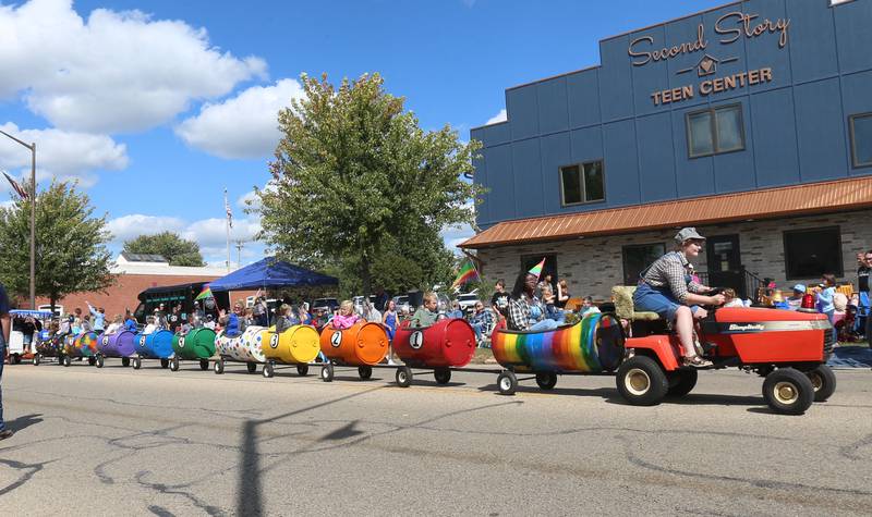 Kids ride colorful barrels during the 54th annual Homestead Festival parade on Saturday, Sept. 6, 2025 in Princeton. Ted Johnson, who drove the waggons for a number of years, passed away ealier this year.