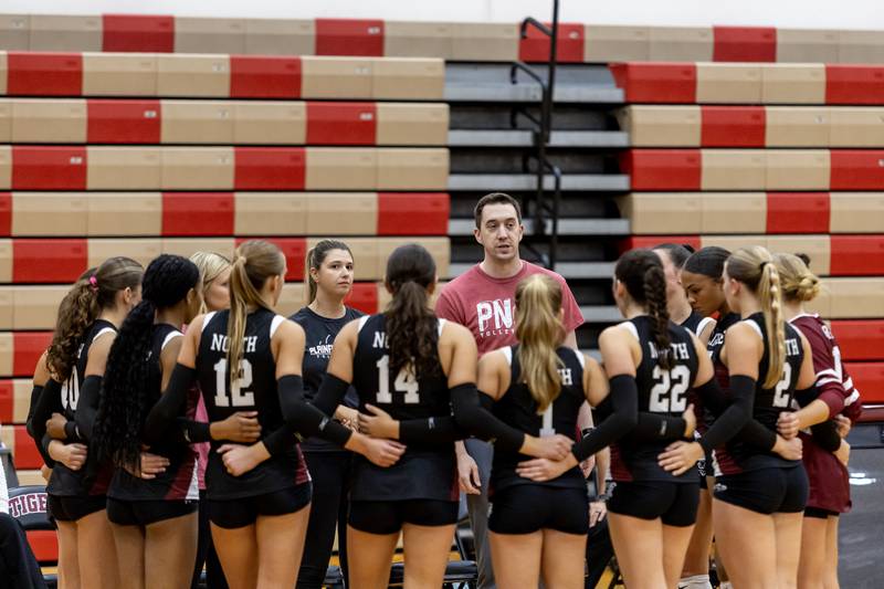 Plainfield North’s head coach Matt Slechta talks to the team between sets during a varsity volleyball home game against Morris on Sept. 2, 2025.