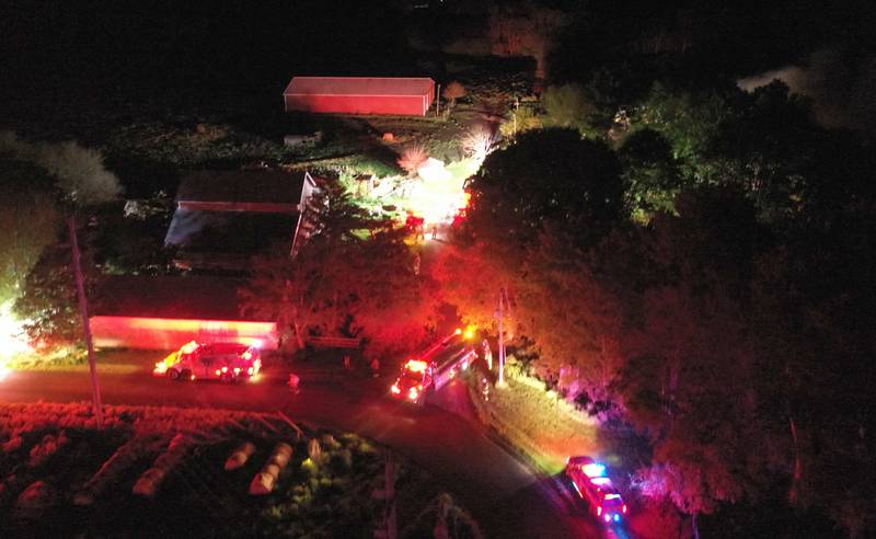 Firefighters flood a residence to fight a barn fire located in the 19000 block of 1725 East Street on Thursday, May 9, 2024 near Princeton. A box alarm was sent out shortly after 9:30p.m. for Bureau County fire units.