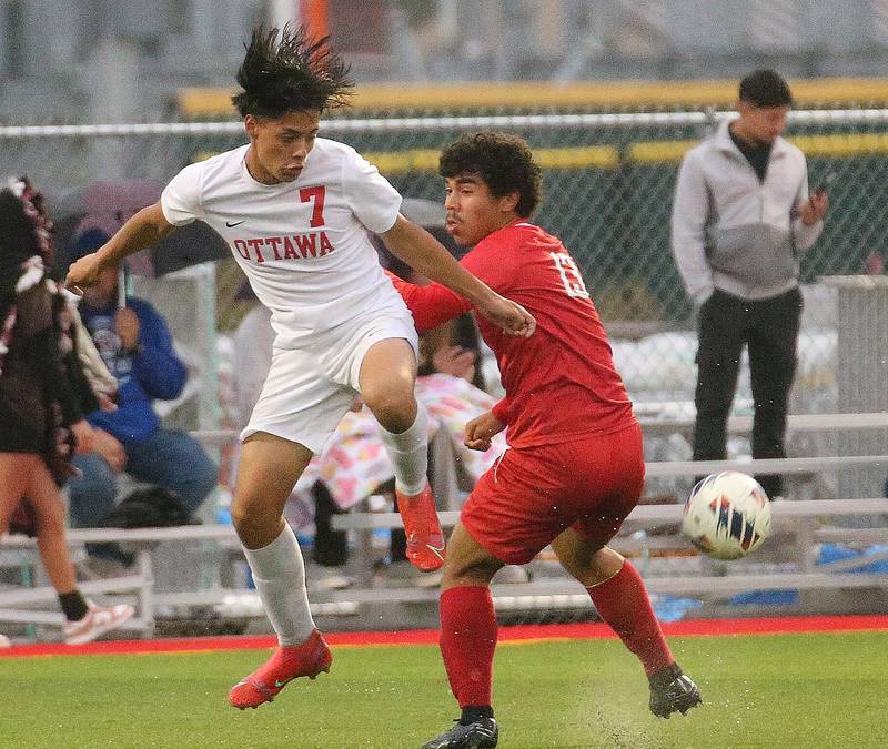 Ottawa's Jorge Lopez kicks the ball ahead of L-P's Christopher Antone on Monday, Sept. 11, 2023 at the L-P Athletic Complex in La Salle.