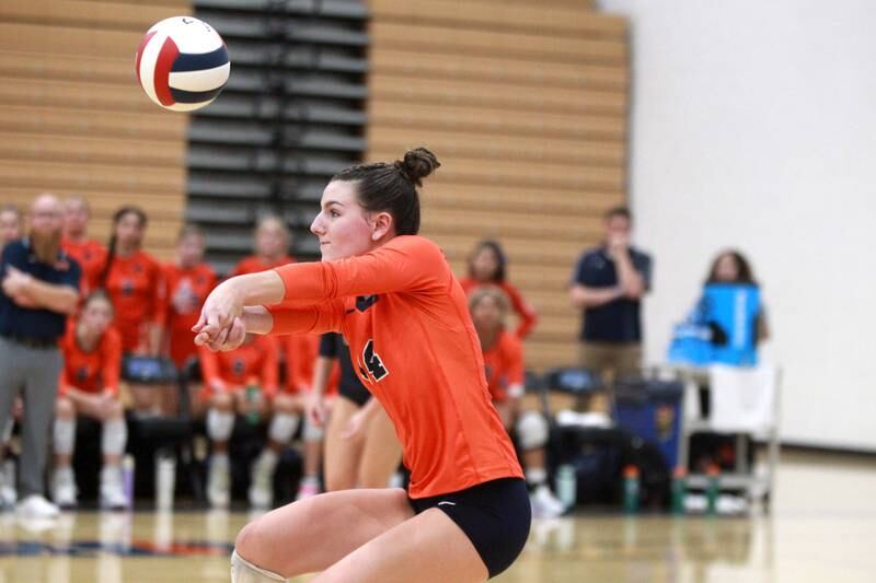 Oswego’s Mia Jurkovic (14) bumps the ball during a game Wednesday, Sept. 18, 2024 at St. Charles North.
