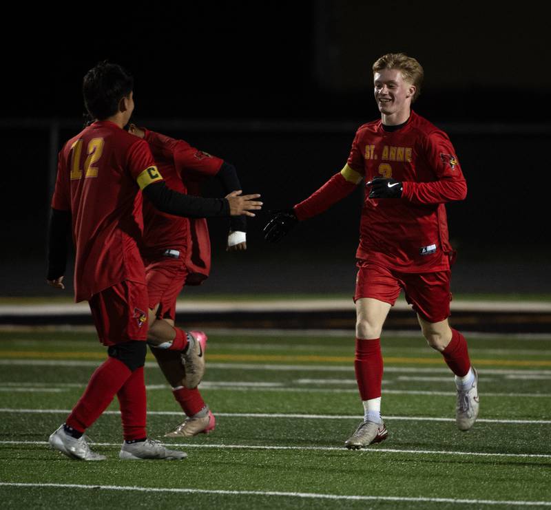 St. Anne's Brigham Hays, right, celebrates his goal, the first of the game, with teammate Erick Franco, left, in a regional match-up against Clifton Central on Tuesday, October 21, 2025.