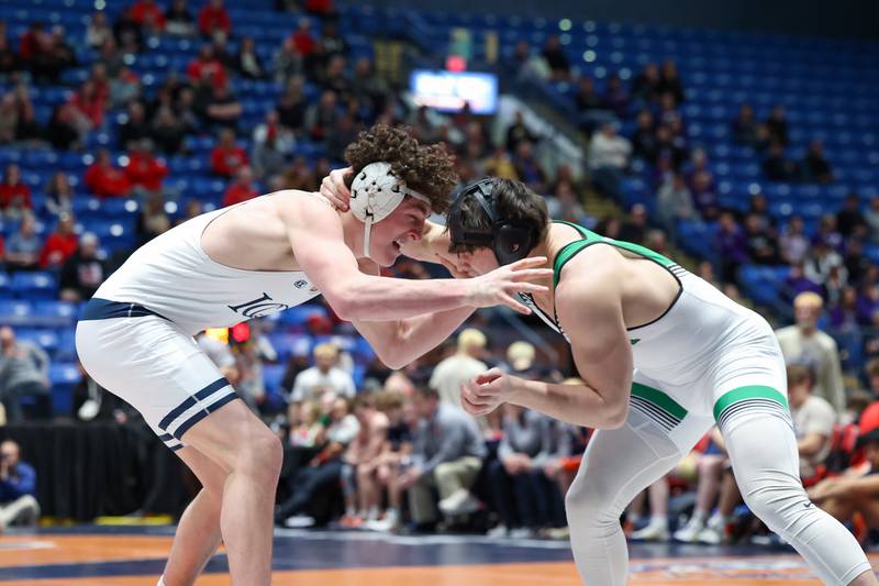 IC Catholic's Brody Kelly grapples with Providence Catholic's Brayden McKay in the 175-pound match during IC Catholic's victory in the IHSA Class 2A Dual Team State championship on Saturday, Feb. 28, 2026.