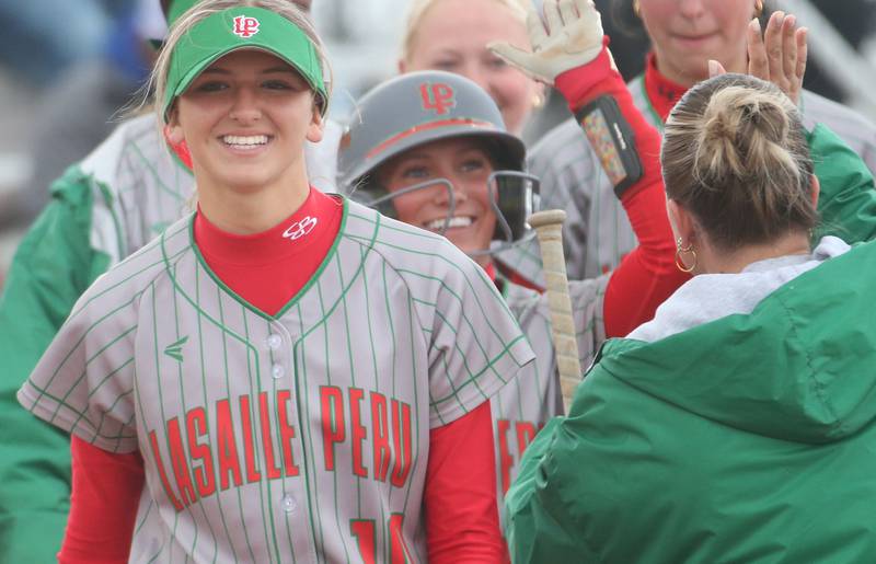 L-P's Kelsey Frederick smiles while walking back to the dugout after teammate Karmen Piano hits a solo home run against Ottawa on Monday, April 21, 2025 at the L-P Athletic Complex in La Salle. Frederick hit a walk-off single to defeat Ottawa 8-7 in fourteen innings.