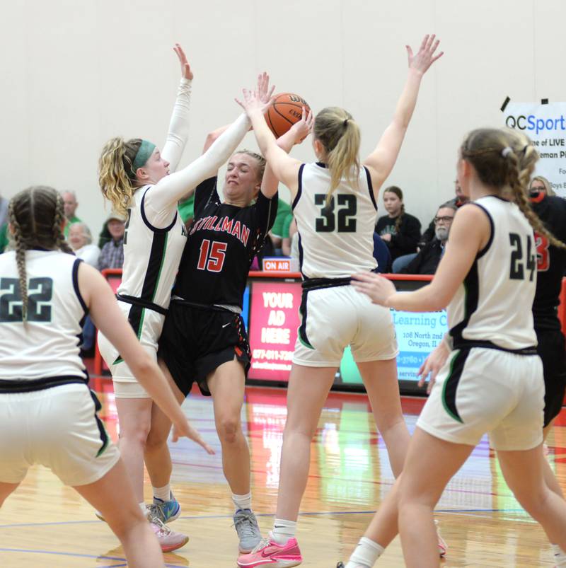Rock Island Alleman defenders converge on Stillman Valley's Taylor Davidson (15) during the championship of the 2A Oregon Sectional on Thursday, Feb. 22, 2024 at the Blackhawk Center at Oregon High School. The Cardinals lost the game 45-36.