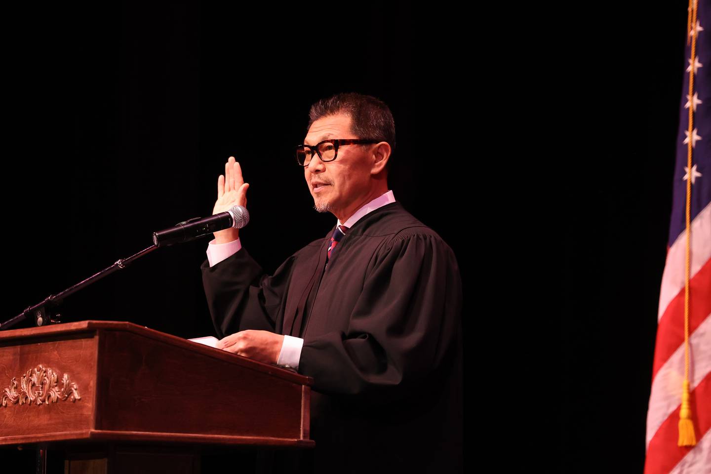 Honrable Young Yim, Judge for the United States District Court for the Northern District of Illinois, administers the Oath of Allegiance during the Special Naturalization Ceremony held at the Rialto Square Theatre in downtown Joliet on Tuesday, April 23, 2024.