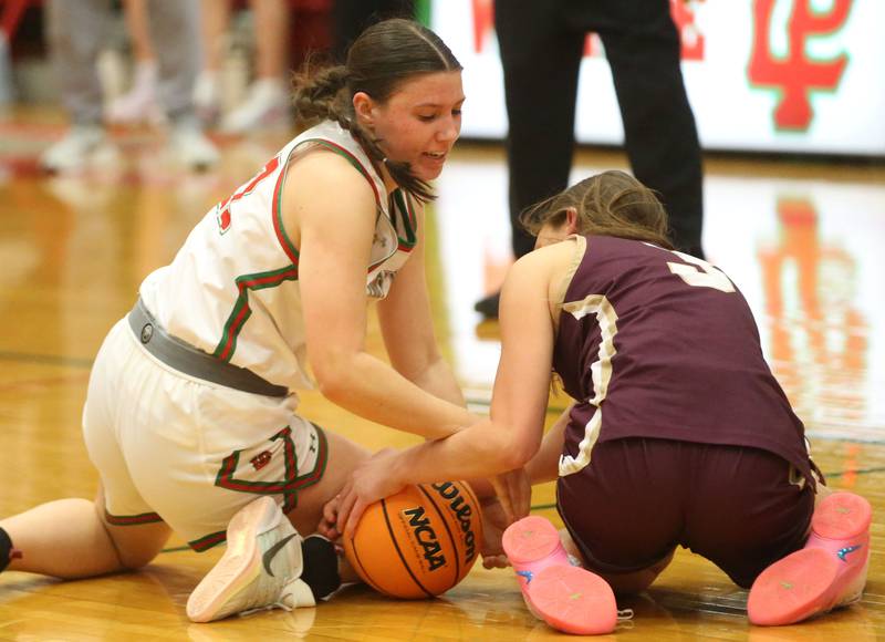 L-P's Brianna Ruppert forces a jump ball on the hardwood with Morris's Lily Hansen on Monday, Feb. 9, 2026 in Sellett Gymnasium at L-P High School.