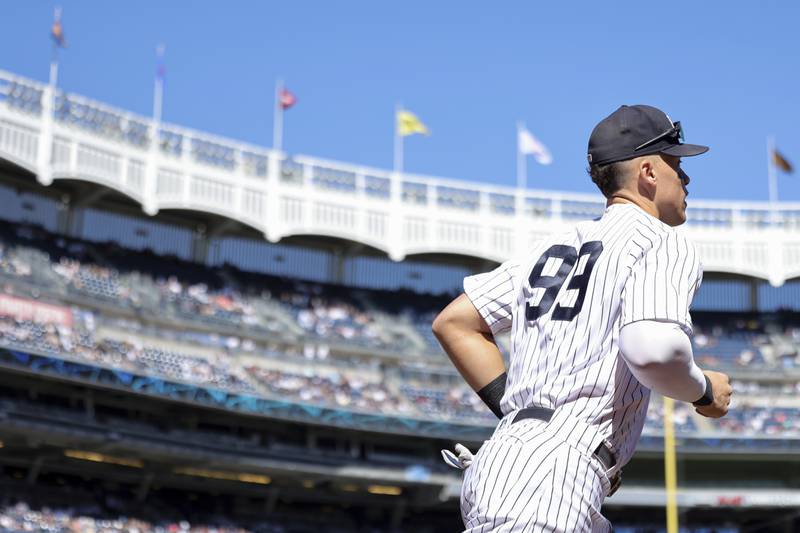 New York Yankees right fielder Aaron Judge (99) runs onto the field during the first inning of a baseball game against the Red Sox Saturday, Sept. 24, 2022, in New York. (AP Photo/Jessie Alcheh)