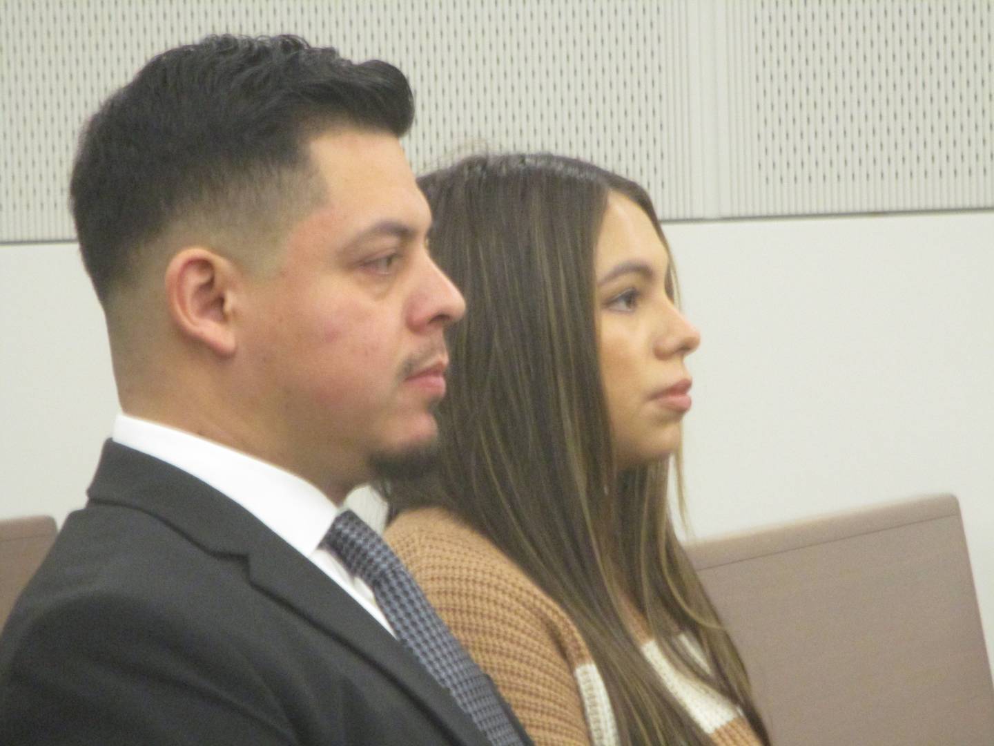 Joliet Councilman Juan Moreno and fiancee Jessica Sanchez on Thursday await the start of a court hearing challenging Moreno's legitimacy to hold office. Dec. 4, 2025