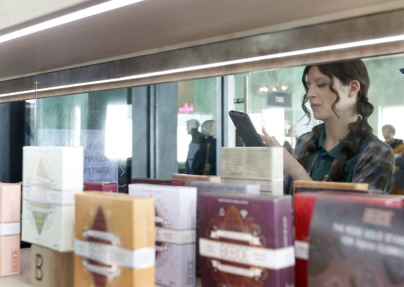 Agent-in-charge Ashley Prado takes a customer's order Thursday, Feb. 2, 2023, at the Ivy Hall Crystal Lake, a social equity-licensed cannabis dispensary that recently opened at 501 Pingree Road in Crystal Lake.