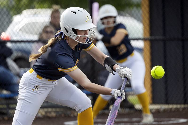Sterling’s Sophie Potthoff pops up a bunt against Lasalle-Peru Tuesday, May 19, 2026, at the Class 3A softball regionals at Sterling.