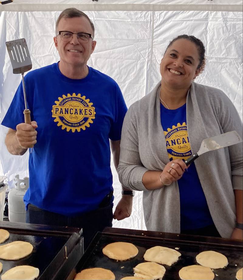 Newest Rotarian Brendan Wilson (left) joins Rotarian and Sycamore Park District Executive Director Jonelle Bailey in preparing pancakes for Sycamore Rotary Club's Pancake Breakfast Oct. 30, 2021, part of Sycamore Pumpkin Festival (photo provided by Sycamore Rotary)