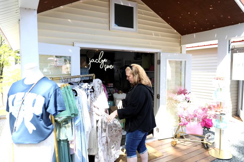 Rachel Miller of Joliet shops at Jaclyn Sue, one of the 2025 Batavia Boardwalk Shops on Friday, May 9, 2025. The cluster of tiny shops on the southeast corner of Wilson and River Streets in Batavia houses 10 independent businesses as a business incubator project of Batavia MainStreet and the City of Batavia.