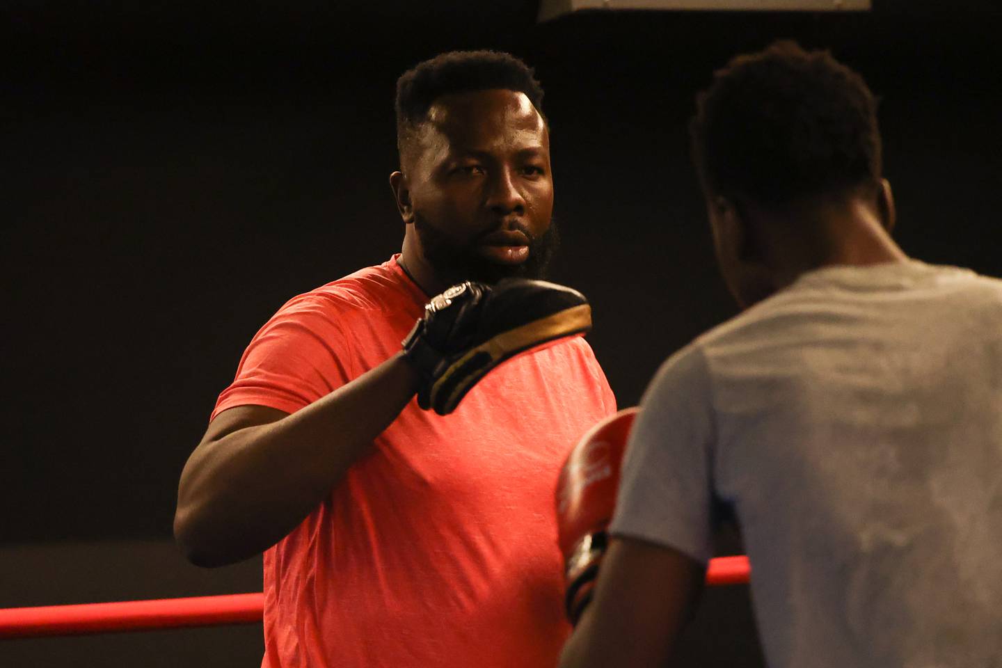 Joseph Awinongya, who came to America in the 90’s to box, trains with his son Joseph “Jojo” at Chicago Sports & Fitness on Tuesday, February 14th.