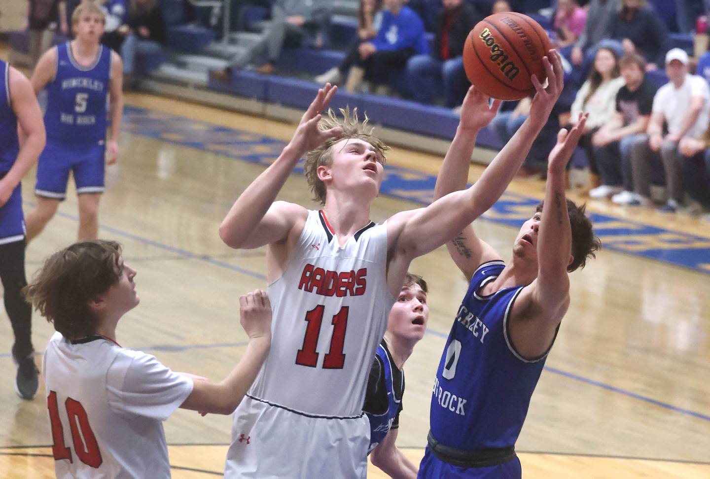 Earlville's Adam Waite and Hinckley-Big Rock’s Landon Roop go after a rebound during last season's semifinals of the Little Ten Conference Tournament at Somonauk High School.