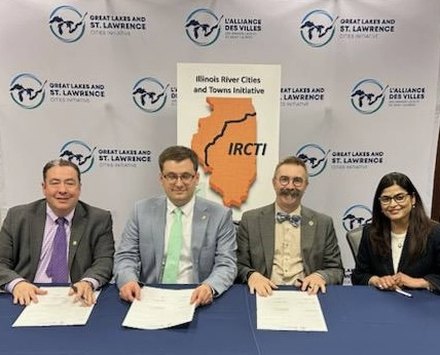 Jonathan Altenberg, Mayor Ryan Sorenson, Mayor Robert Hasty, and Anshu Singh pose for a photo following the signing of a regional partnership agreement in Milwaukee. From left: Altenberg, president and CEO of the Great Lakes and St. Lawrence Cities Initiative; Sorenson, mayor of Sheboygan, Wis.; Hasty, mayor of Ottawa, Ill.; and Singh, director of the Illinois River Cities and Towns Initiative.